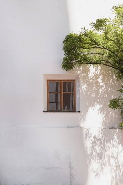 Traditional European old town building. Old historic architecture in Italy. Sunlight shadows on the wall