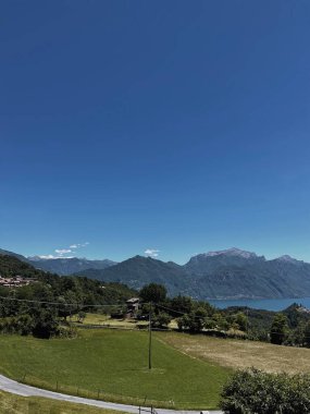 Picturesque view of field, mountain hill, sky. Scenic summer landscape