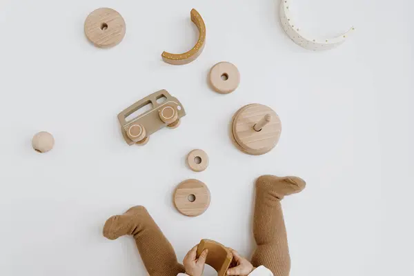 Baby Kid Playing Wooden Toys Top View Neutral Beige Colors — Stock Photo, Image
