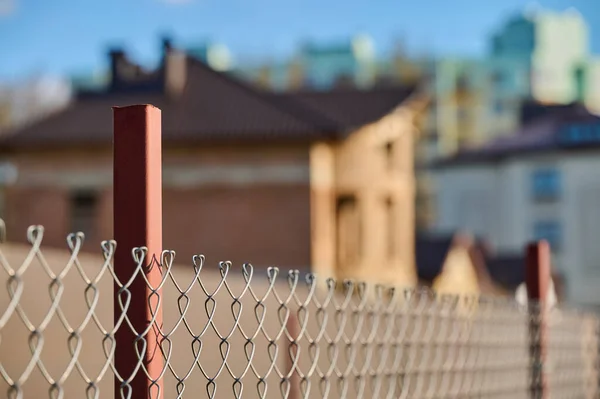 high-rise buildings behind a wire fence. High quality photo