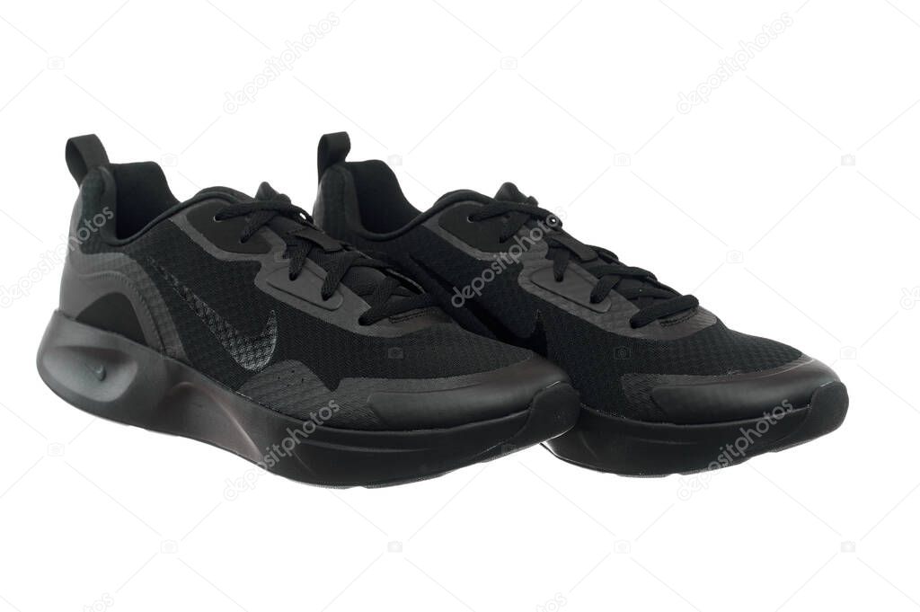 Ukraine, Ivano-Frankivsk - 01.05.2023. Editorial. Nike Wearallday CJ1682-003 model. Comfy pair of running shoes. Black nike sneakers on white background.