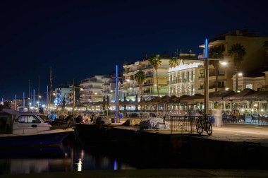 Boats in the harbor at night, Calamata, Greece