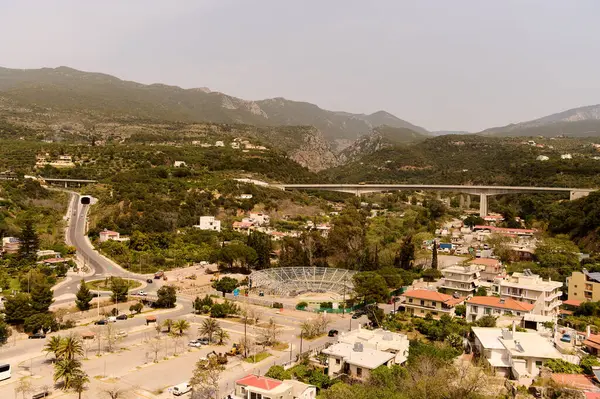 View from the mountain to the road, stadium and bridge in the city of Kalamata.