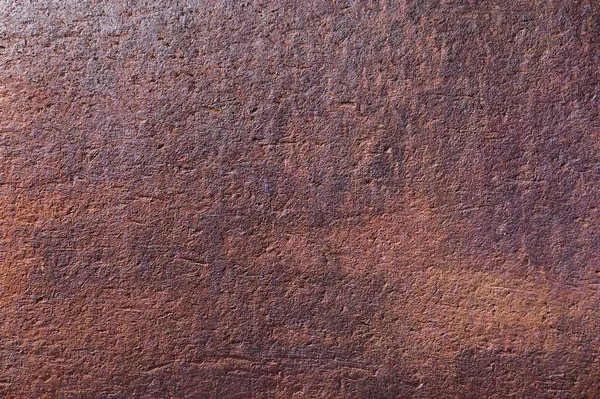 Detaylı yüzey, doğal ışıkla hafifçe aydınlatılan sıcak renk ve dokuların büyüleyici bir karışımını içerir..