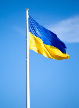 Flag of ukraine against the blue sky close-up. National pride and symbol of the country Ukraine. War in Ukraine. Yellow-blue flag.