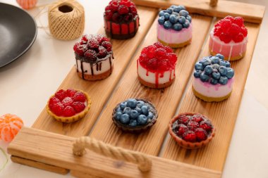 Handmade soap. Cold Processed Handcrafted Soap.Home made soap look like cake with berries on light background. Natural homemade cosmetics and handmade soaps concept.