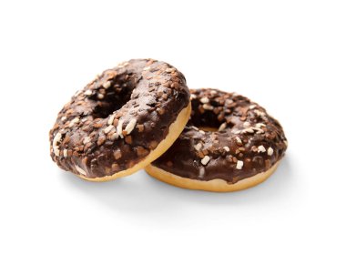 Donuts in chocolate isolated. Sweet breakfast. Dessert. Junk food. Two chocolate donuts on a white background.
