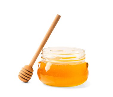 Fresh honey in a jar with a wooden dipper on a white isolated background.Honey in an open glass jar with a honey stick. Honey in a jar on a white background.
