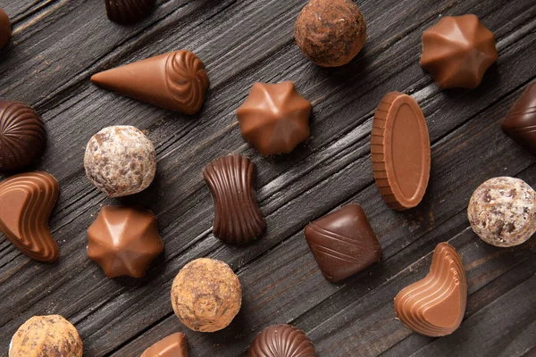 Different Chocolate Candies Dark Wooden Texture Background Top View Assorted — 스톡 사진
