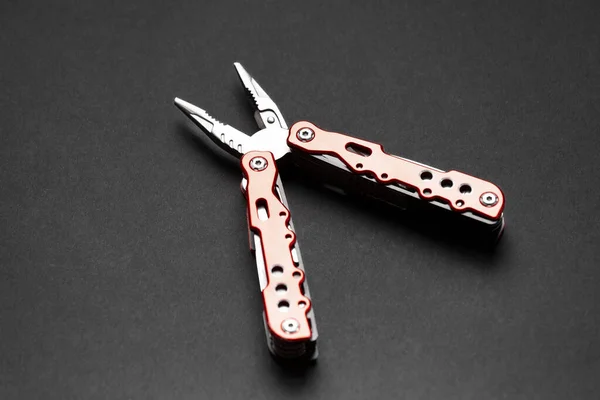 Universal Multifunctional Knife Pliers Different Nozzles Red Handle Dark Gray — Stock Photo, Image
