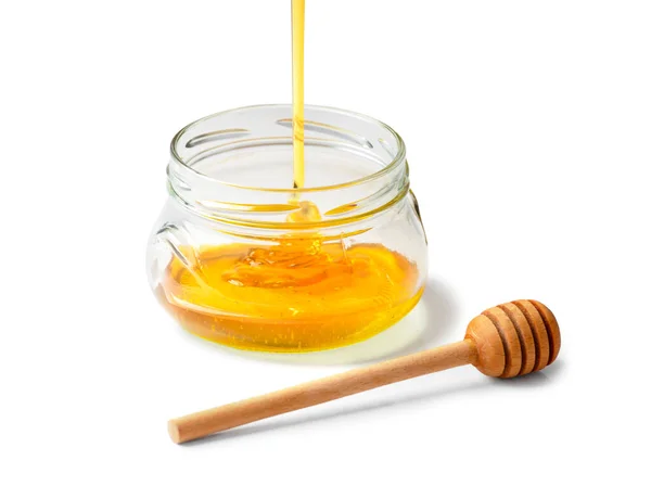 Honey Poured Empty Glass Transparent Jar Wooden Dipper White Background — Stock Fotó