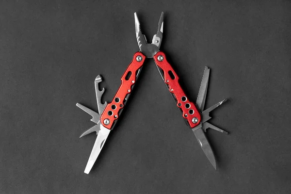 Universal Multifunctional Knife Pliers Different Nozzles Red Handle Dark Gray — Stock Photo, Image