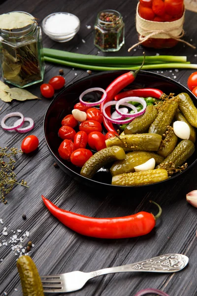 Assorted Pickled Vegetables Canned Tomatoes Cucumbers Chili Peppers Black Plate — Stock Photo, Image