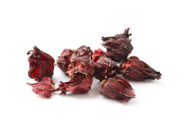 Hibiscus tea on a white background close-up. Dry flowers of red hibiscus on isolation. A handful of hibiscus for making tea. Ingredients for preparing a healthy drink.