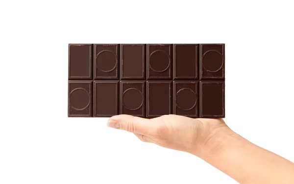 白い背景に手にダークチョコレートのバー 女性手ホールドチョコレートオンホワイト孤立 — ストック写真