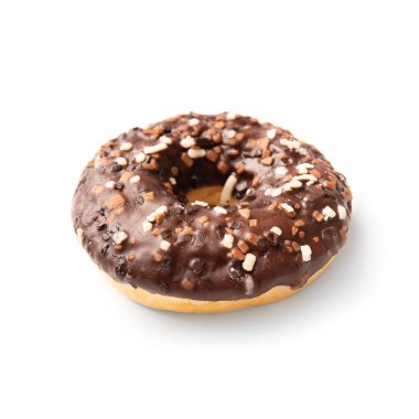 One donut in chocolate glaze sprinkled with pieces of white, milk and dark chocolate isolated on a white background. High-calorie junk food. Sweet snack. Baking for breakfast.