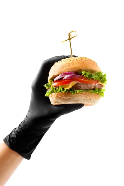 Una Mano Guanto Nero Tiene Succoso Appetitoso Hamburger Manzo Sfondo — Foto Stock