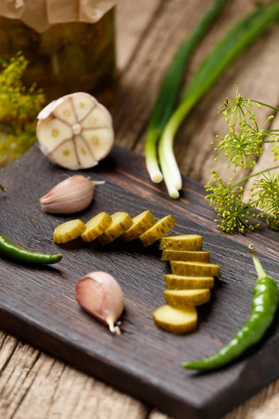 Sliced Pickled Canned Cucumber Dark Wooden Cutting Board Fresh Garlic — Stock Photo, Image