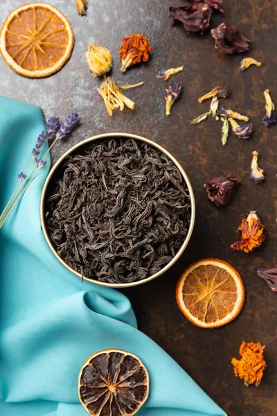Composition Black Green Flower Tea Dried Orange Slices Blue Brown — Stock Photo, Image