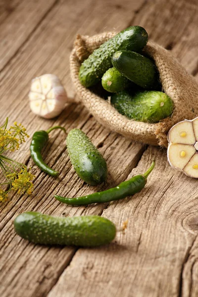 Fresh Cucumbers Burlap Garlic Peppers Old Wooden Background Close Organic — Stock Photo, Image