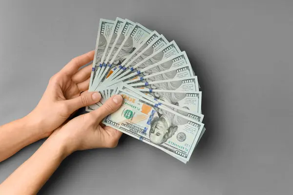 Sacco Banconote 100 Dollari Mano Sono Piegate Ventilatore Uno Sfondo — Foto Stock