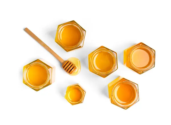 Creative Composition Honey Open Jars Form Honeycombs Wooden Dipper White — Stock Photo, Image