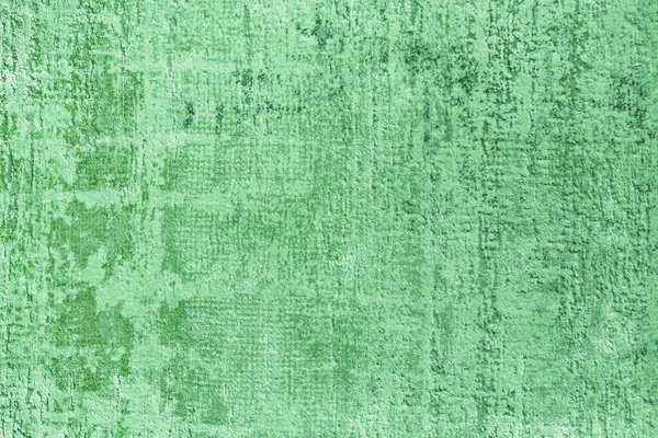 Texture of a natural green carpet with an abstract pattern, close-up. Modern carpet, carpet fabric background, design, floor carpet, interior design elements.