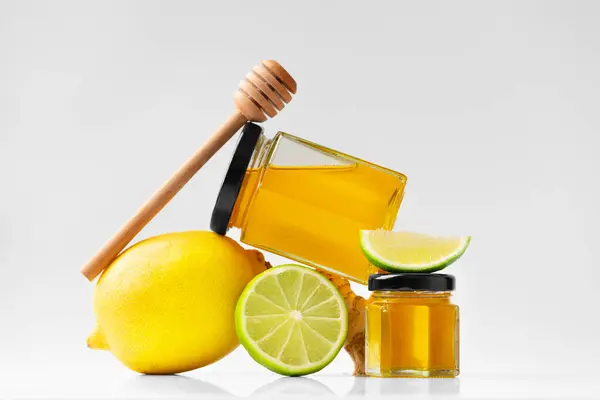 Conceptual Composition Honey Closed Jar Dipper Lemon Lime Ginger White — Stock Photo, Image