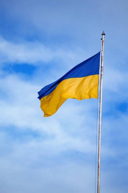 Flag of ukraine against the blue sky close-up. National pride and symbol of the country Ukraine. War in Ukraine. Yellow-blue flag.