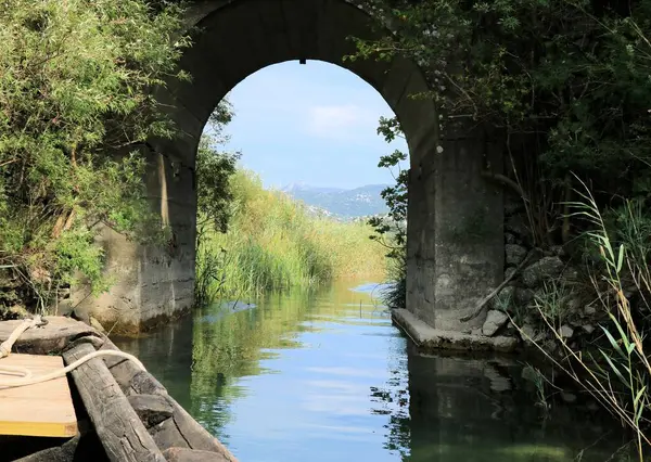 stock image boating under the bridge of the Bacina lakes in Croatia