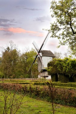 Windmill in the rural landscape of Genk, Belgium clipart