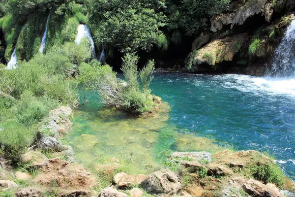 The lovely shades of blue and green of the Krupa river, Croatia