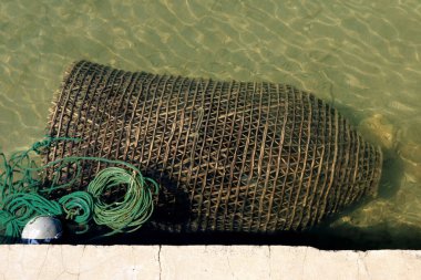 fish basket on Saplunara beach on the island Mljet, Croatia clipart