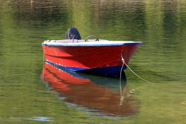 Red sloop in the Saplunara bay on the island Mljet, Croatia clipart