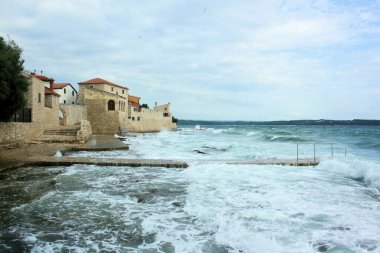 wild sea with waves in Novigrad, Cittanova, Croatia clipart