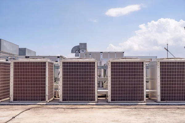 Array of outdoor fan air conditioner on the roof top building. The photo is suitable to use for construction and maintenance of air conditioner.