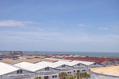 Arial view of power plant project with blue sky and cloudy vibes. The photo is suitable to use for industry background photography, power plant poster and electricity content media.