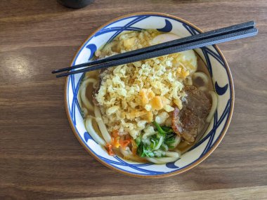 Close up of beef Udon with hot chili spicy and curry soup. The photo is suitable to use for Japan traditional food background, poster and food content media.
