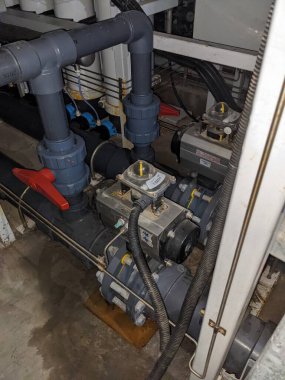 Power plant project activity for water treatment plant and checking equipment. The photo is suitable to use for industry background, construction poster and safety content media.