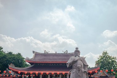 Traditional Chinese guardian gate statute on the Chinese temples when Chinese new years. The photo is suitable to use for Chinese new year, lunar new year background and content media.
