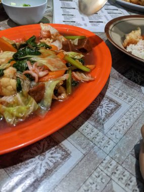 Capcay traditional Chinese food with full vegetables and chicken sausage. The photo is suitable to use for traditional food background, poster and food content media.