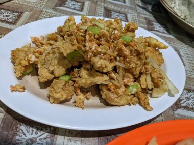 Chicken salted eggs crispy traditional food of Semarang. The photo is suitable to use for traditional food background, poster and food content.