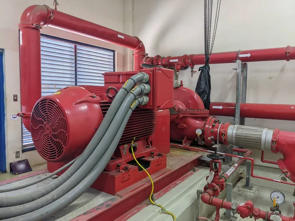 Emergency diesel and electric fire pump for power plant project. The photo is suitable to use for safety content media and fire protection background.