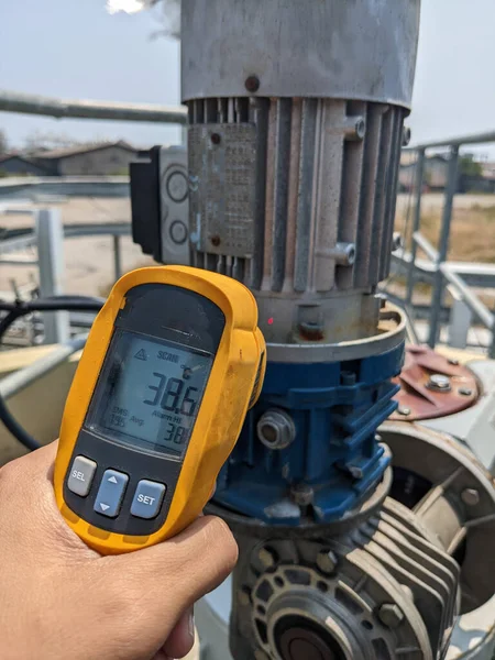 Check temperature of body motor agitator of sludge clarifier The photo is suitable to use for industry background photography, power plant poster and maintenance content media.