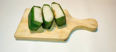 Indonesian Tradisional food called lemper contain rice cake with shredded chicken, fish or abon (meat floss) inside, isolated on white