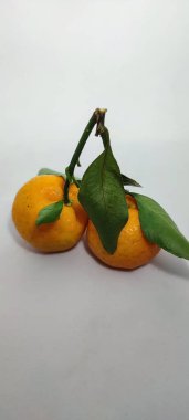 the orange mandarin as we know santang orange or shantang isolated on white background, orange mandarin isolated on white backgroun, fresh and sweet mandarin orange with leaves,
