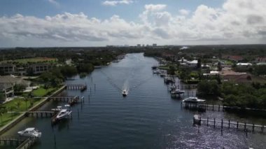 This 4K aerial drone footage offers a stunning view of a property located along the Florida intracoastal waterway. The footage captures the picturesque setting of the property, showcasing its location on the water.
