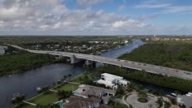 This 4K aerial drone footage offers a unique and visually stunning perspective of a drawbridge located along the Florida Intracoastal Waterway. The footage is shot in ultra-high-definition 4K resolution