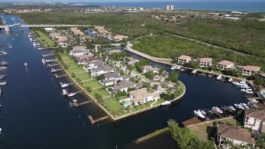 This 4K aerial drone footage offers a breathtaking view of a residential property located along the Florida Intracoastal. The footage captures the picturesque setting of the property, showcasing its location on the water.