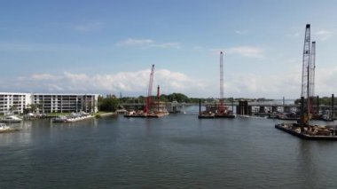 Stunning 1080P drone footage of a construction barge captured from above, providing an aerial view of the work being done. Perfect for construction companies and builders to showcase their projects.